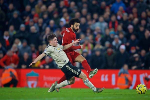 LIVERPOOL, ENGLAND - Sunday, January 19, 2020: Liverpool's Mohamed Salah takes off his shirt as he celebrates scoring the second goal during the FA Premier League match between Liverpool FC and Manchester United FC at Anfield. (Pic by David Rawcliffe/Propaganda)