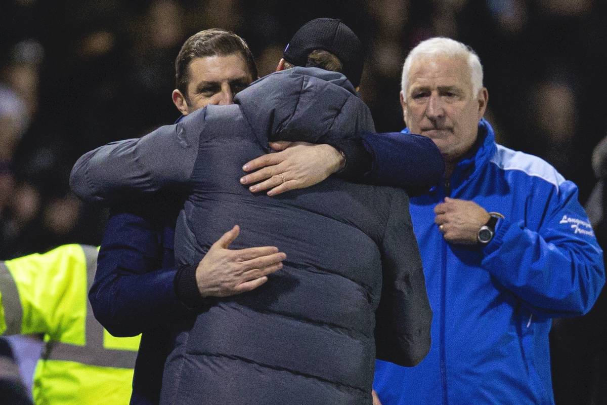 SHREWSBURY, ENGLAND - Sunday, January 26, 2020: Liverpool's manager Jürgen Klopp embraces Shrewsbury Town's manager Sam Ricketts after the FA Cup 4th Round match between Shrewsbury Town FC and Liverpool FC at the New Meadow. The game ended in a 2-2 draw. (Pic by David Rawcliffe/Propaganda)