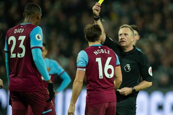 LONDON, ENGLAND - Wednesday, January 29, 2020: West Ham United's Issa Diop is shown a yellow card by referee Jonathan Moss during the FA Premier League match between West Ham United FC and Liverpool FC at the London Stadium. (Pic by David Rawcliffe/Propaganda)