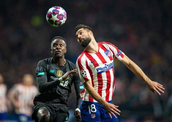 MADRID, SPAIN - Tuesday, February 18, 2020: Liverpool's Divock Origi (L) and Club Atlético de Madrid's Felipe Augusto de Almeida Monteiro during the UEFA Champions League Round of 16 1st Leg match between Club Atlético de Madrid and Liverpool FC at the Estadio Metropolitano. (Pic by David Rawcliffe/Propaganda)