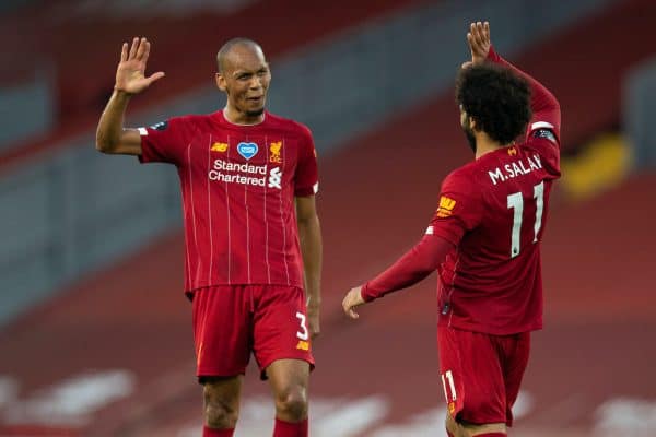 LIVERPOOL, ENGLAND - Wednesday, June 24, 2020: Liverpool’s Fabio Henrique Tavares 'Fabinho' (L) celebrates scoring the third goal with team-mate Mohamed Salah (R) during the FA Premier League match between Liverpool FC and Crystal Palace FC at Anfield. The game was played behind closed doors due to the UK government’s social distancing laws during the Coronavirus COVID-19 Pandemic. (Pic by David Rawcliffe/Propaganda)