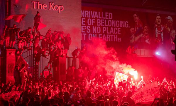 LIVERPOOL, ENGLAND - Thursday, June 25, 2020: Liverpool supporters congregate outside the famous Spion Kop at Anfield as they celebrate after their side were crowned Premier League Champions following Manchester City's defeat by Chelsea. The supporters have waited 30 years for this their 19th Championship title. (Pic by David Rawcliffe/Propaganda)