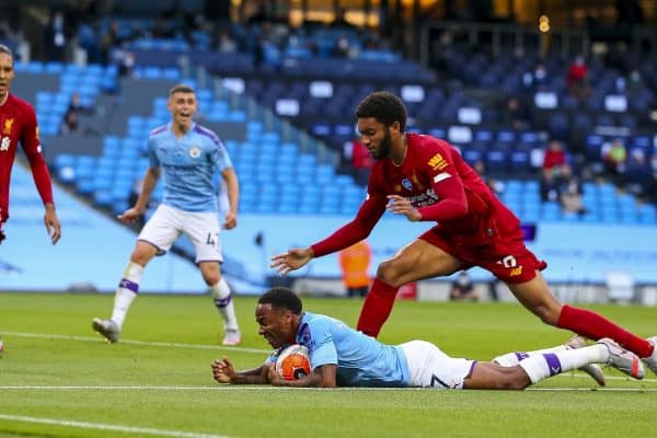 MANCHESTER, ENGLAND - Thursday, July 2, 2020: Manchester City's Raheem Sterling goes down in the area under pressure from Liverpool’s Joe Gomez to win a penalty during the FA Premier League match between Manchester City FC and Liverpool FC at the City of Manchester Stadium. The game was played behind closed doors due to the UK government’s social distancing laws during the Coronavirus COVID-19 Pandemic. This was Liverpool's first game as Premier League 2019/20 Champions. (Pic by Propaganda)