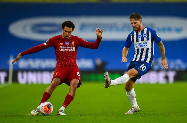 BRIGHTON & HOVE, ENGLAND - Wednesday, July 8, 2020: Liverpool's Trent Alexander-Arnold crosses the ball under pressure from Brighton & Hove Albion's Alexis Mac Allister during the FA Premier League match between Brighton & Hove Albion FC and Liverpool FC at the AMEX Stadium. The game was played behind closed doors due to the UK government’s social distancing laws during the Coronavirus COVID-19 Pandemic. (Pic by Propaganda)