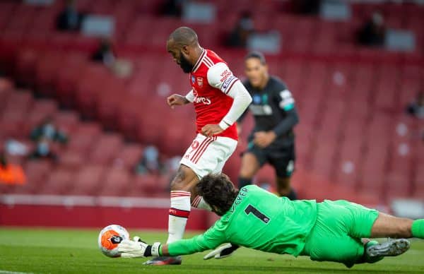 LONDON, ENGLAND - Tuesday, July 14, 2020: Arsenal's Alexandre Lacazette rounds Liverpool's goalkeeper Alisson Becker to score the first equalising goal during the FA Premier League match between Arsenal FC and Liverpool FC at the Emirates Stadium. The game was played behind closed doors due to the UK government’s social distancing laws during the Coronavirus COVID-19 Pandemic. (Pic by David Rawcliffe/Propaganda)