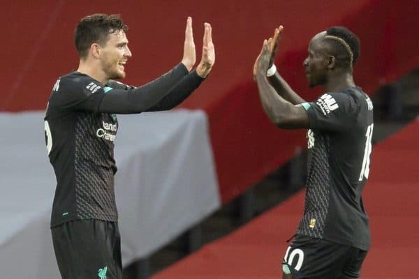 LONDON, ENGLAND - Tuesday, July 14, 2020: Liverpool’s Sadio Mané (R) celebrates scoring the first goal with team-mate Andy Robertson during the FA Premier League match between Arsenal FC and Liverpool FC at the Emirates Stadium. The game was played behind closed doors due to the UK government’s social distancing laws during the Coronavirus COVID-19 Pandemic. (Pic by David Rawcliffe/Propaganda)