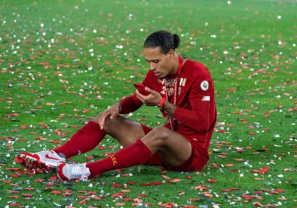 LIVERPOOL, ENGLAND - Wednesday, July 22, 2020: Liverpool's Virgil van Dijk finds a quiet moment to make a Face Time call after being crowned Champions after the FA Premier League match between Liverpool FC and Chelsea FC at Anfield. The game was played behind closed doors due to the UK government’s social distancing laws during the Coronavirus COVID-19 Pandemic. Liverpool won 5-3. (Pic by David Rawcliffe/Propaganda)