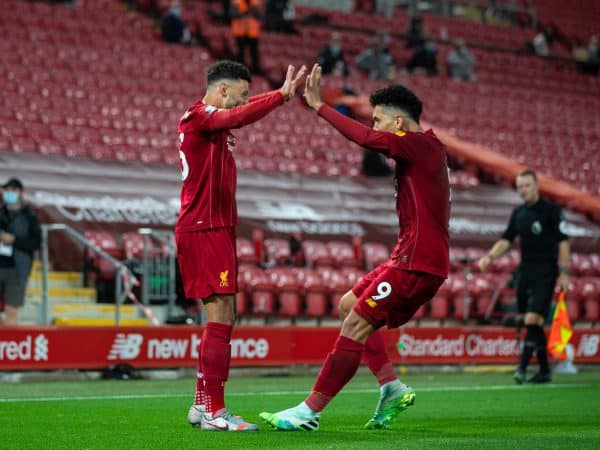 LIVERPOOL, ENGLAND - Wednesday, July 22, 2020: Liverpool’s Alex Oxlade-Chamberlain celebrates scoring the fifth goal with team-mate Roberto Firmino during the FA Premier League match between Liverpool FC and Chelsea FC at Anfield. The game was played behind closed doors due to the UK government’s social distancing laws during the Coronavirus COVID-19 Pandemic. (Pic by David Rawcliffe/Propaganda)