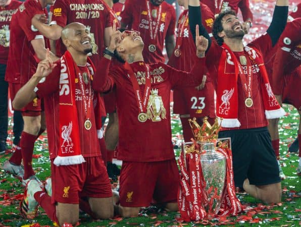 LIVERPOOL, ENGLAND - Wednesday, July 22, 2020: Liverpool’s three Brazilians Fabio Henrique Tavares 'Fabinho', Roberto Firmino and goalkeeper Alisson Becker with the Premier League trophy after as their side are crowned Champions after the FA Premier League match between Liverpool FC and Chelsea FC at Anfield. The game was played behind closed doors due to the UK government’s social distancing laws during the Coronavirus COVID-19 Pandemic. Liverpool won 5-3. (Pic by David Rawcliffe/Propaganda)