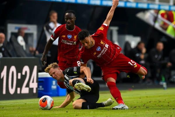 LIVERPOOL, ENGLAND - Sunday, July 26, 2020: Liverpool’s Naby Keita (L) and Alex Oxlade-Chamberlain (R) challenge Newcastle United's Matt Ritchie during the final match of the FA Premier League season between Newcastle United FC and Liverpool FC at St. James' Park. The game was played behind closed doors due to the UK government’s social distancing laws during the Coronavirus COVID-19 Pandemic. (Pic by David Rawcliffe/Propagandab)