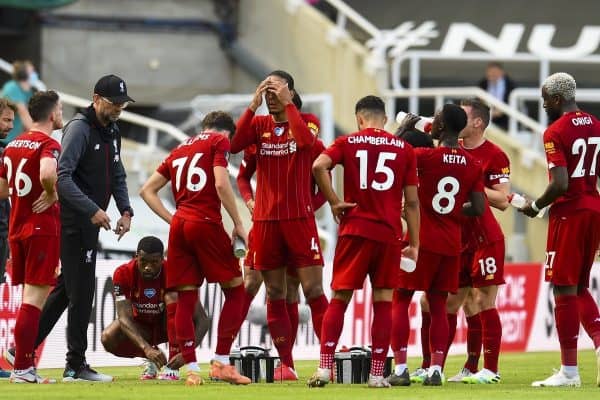 LIVERPOOL, ENGLAND - Sunday, July 26, 2020: Liverpool’s manager Jürgen Klopp speaks to his players during a water break during the final match of the FA Premier League season between Newcastle United FC and Liverpool FC at St. James' Park. The game was played behind closed doors due to the UK government’s social distancing laws during the Coronavirus COVID-19 Pandemic. (Pic by David Rawcliffe/Propagandab)