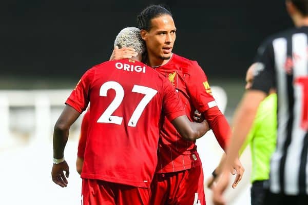 LIVERPOOL, ENGLAND - Sunday, July 26, 2020: Divock Origi (L) celebrates scoring the second goal with team-mate Virgil van Dijk during the final match of the FA Premier League season between Newcastle United FC and Liverpool FC at St. James' Park. The game was played behind closed doors due to the UK government’s social distancing laws during the Coronavirus COVID-19 Pandemic. (Pic by Propaganda)