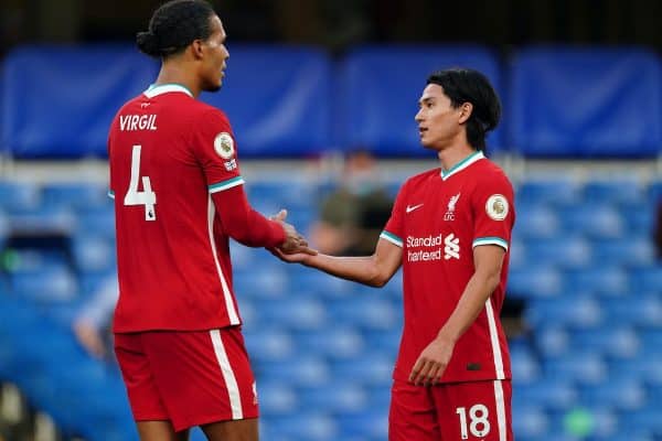 LONDON, ENGLAND - Sunday, September 20, 2020: Liverpool’s Virgil van Dijk (L) and Takumi Minamino at the final whistle during the FA Premier League match between Chelsea FC and Liverpool FC at Stamford Bridge. The game was played behind closed doors due to the UK government’s social distancing laws during the Coronavirus COVID-19 Pandemic. (Pic by Propaganda)