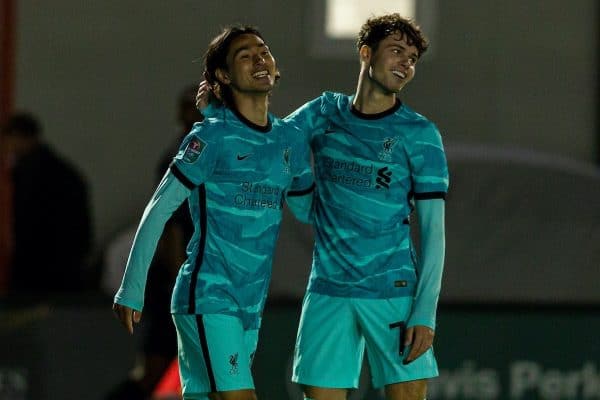 LINCOLN, ENGLAND - Thursday, September 24, 2020: Liverpool's Takumi Minamino celebrates with team-mate Neco Williams (R) after scoring the fifth goal, his second, to make the score 5-0 during the Football League Cup 3rd Round match between Lincoln City FC and Liverpool FC at Sincil Bank. (Pic by David Rawcliffe/Propaganda)