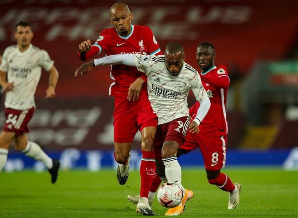 LIVERPOOL, ENGLAND - Monday, September 28, 2020: Liverpool’s Fabio Henrique Tavares 'Fabinho' (L) challenges Arsenal's Alexandre Lacazette during the FA Premier League match between Liverpool FC and Arsenal FC at Anfield. The game was played behind closed doors due to the UK government’s social distancing laws during the Coronavirus COVID-19 Pandemic. (Pic by Propaganda)