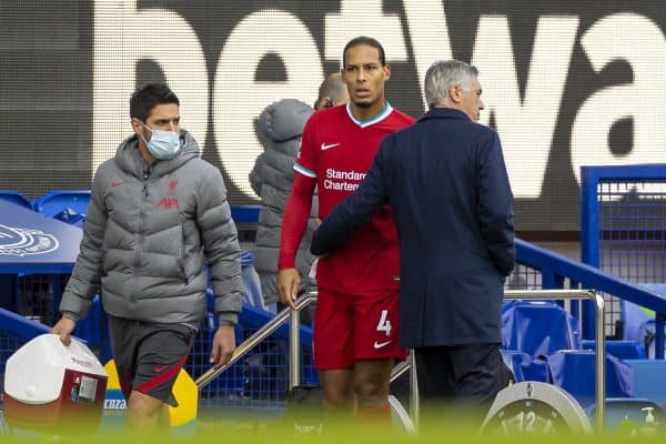 LIVERPOOL, ENGLAND - Saturday, October 17, 2020: Liverpool’s Virgil van Dijk walks off injured past Everton's manager Carlo Ancelotti during the FA Premier League match between Everton FC and Liverpool FC, the 237th Merseyside Derby, at Goodison Park. The game was played behind closed doors due to the UK government’s social distancing laws during the Coronavirus COVID-19 Pandemic. (Pic by David Rawcliffe/Propaganda)