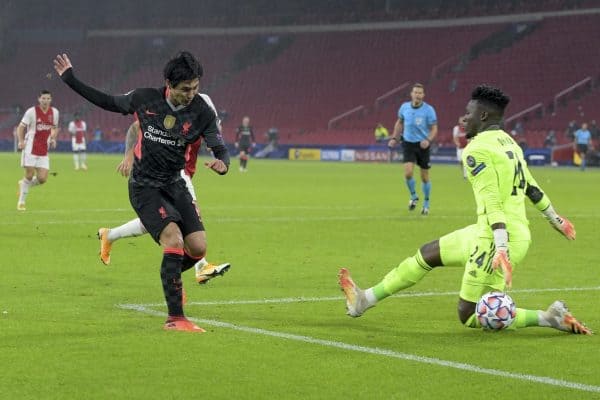 AMSTERDAM, THE NETHERLANDS - Wednesday, October 21, 2020: Liverpool's Takumi Minamino sees his shot saved by Ajax's goalkeeper André Onana during the opening UEFA Champions League Group D match between AFC Ajax and Liverpool FC at the Johan Cruijff ArenA. (Pic by Gerrit van Keulen/Orange Pictures via Propaganda)