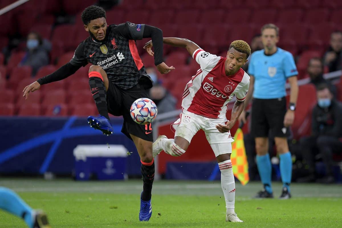 AMSTERDAM, THE NETHERLANDS - Wednesday, October 21, 2020: Liverpool's Joe Gomez (L) and Ajax's David Neres during the opening UEFA Champions League Group D match between AFC Ajax and Liverpool FC at the Johan Cruijff ArenA. (Pic by Gerrit van Keulen/Orange Pictures via Propaganda)
