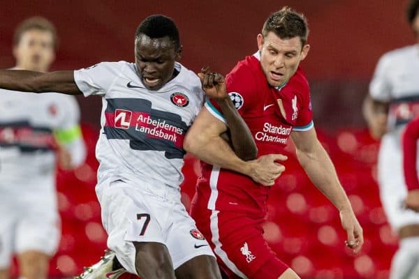 LIVERPOOL, ENGLAND - Tuesday, October 27, 2020: Liverpool's James Milner (R) grapples with FC Midtjylland's Pione Sisto during the UEFA Champions League Group D match between Liverpool FC and FC Midtjylland at Anfield. (Pic by David Rawcliffe/Propaganda)