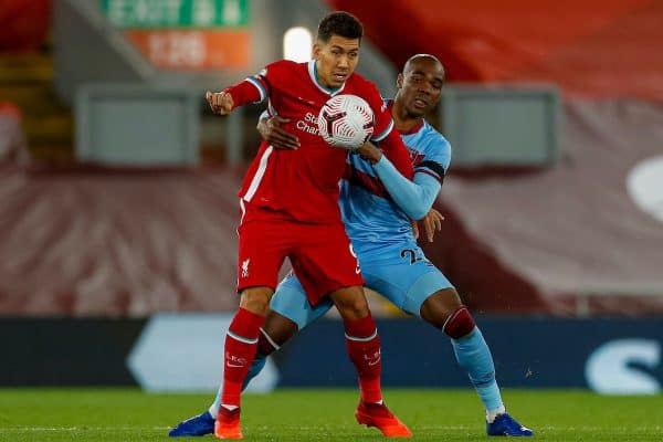 LIVERPOOL, ENGLAND - Saturday, October 31, 2020: Liverpool’s Roberto Firmino (L) and West Ham United's Angelo Ogbonna during the FA Premier League match between Liverpool FC and West Ham United FC at Anfield. The game was played behind closed doors due to the UK government’s social distancing laws during the Coronavirus COVID-19 Pandemic. (Pic by Propaganda)