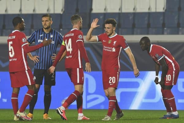 BERGAMO, ITALY - Tuesday, November 3, 2020: Liverpool's Diogo Jota (R) celebrates with team-mate captain Jordan Henderson after scoring the fifth goal, completing his hat-trick, during the UEFA Champions League Group D match between Atalanta BC and Liverpool FC at the Stadio di Bergamo. (Pic by Simone Arveda/Propaganda)