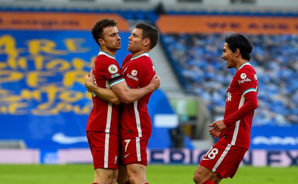 BRIGHTON & HOVE, ENGLAND - Saturday, November 28, 2020: Liverpool's Diogo Jota (L) celebrates with team-mates James Milner (C) and Takumi Minamino (R) after scoring the first goal during the FA Premier League match between Brighton & Hove Albion FC and Liverpool FC at the AMEX Stadium. The game was played behind closed doors due to the UK government’s social distancing laws during the Coronavirus COVID-19 Pandemic. (Pic by Propaganda)