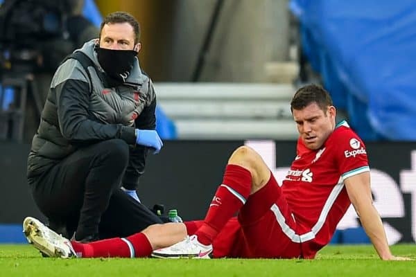 BRIGHTON & HOVE, ENGLAND - Saturday, November 28, 2020: Liverpool's James Milner is treated for an injury during the FA Premier League match between Brighton & Hove Albion FC and Liverpool FC at the AMEX Stadium. The game was played behind closed doors due to the UK government’s social distancing laws during the Coronavirus COVID-19 Pandemic. (Pic by Propaganda)