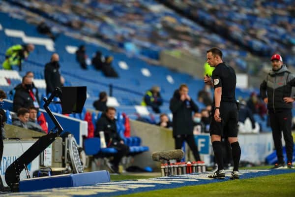 BRIGHTON & HOVE, ENGLAND - Saturday, November 28, 2020: Referee Stuart Atwell looks at the VAR monitor before awarding Brighton & Hove Albion a penalty during the FA Premier League match between Brighton & Hove Albion FC and Liverpool FC at the AMEX Stadium. The game was played behind closed doors due to the UK government’s social distancing laws during the Coronavirus COVID-19 Pandemic. (Pic by Propaganda)