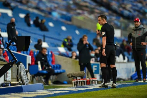 BRIGHTON & HOVE, ENGLAND - Saturday, November 28, 2020: Referee Stuart Atwell looks at the VAR monitor before awarding Brighton & Hove Albion a penalty during the FA Premier League match between Brighton & Hove Albion FC and Liverpool FC at the AMEX Stadium. The game was played behind closed doors due to the UK government’s social distancing laws during the Coronavirus COVID-19 Pandemic. (Pic by Propaganda)