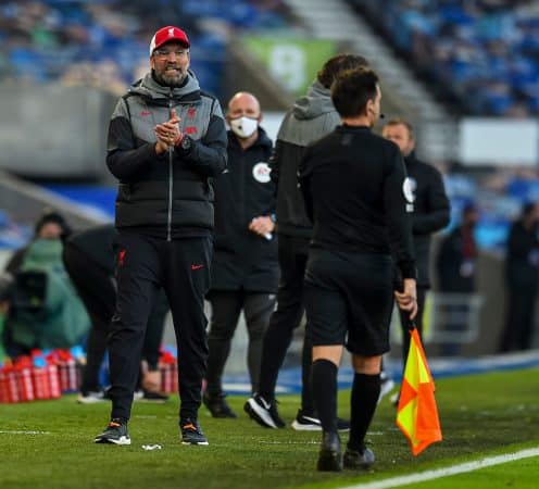 BRIGHTON & HOVE, ENGLAND - Saturday, November 28, 2020: Liverpool's manager Jürgen Klopp and goalkeeper Alisson Becker fist bump referee Stuart Atwell after the FA Premier League match between Brighton & Hove Albion FC and Liverpool FC at the AMEX Stadium. The game was played behind closed doors due to the UK government’s social distancing laws during the Coronavirus COVID-19 Pandemic. (Pic by Propaganda)