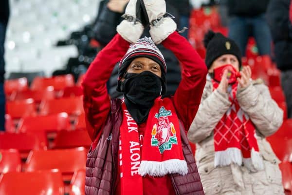 LIVERPOOL, ENGLAND - Sunday, December 6, 2020: A Liverpool supporter on the Spion Kop greets the players as the club prepare to welcome 2,000 spectators back into the stadium, pictured before the FA Premier League match between Liverpool FC and Wolverhampton Wanderers FC at Anfield. (Pic by David Rawcliffe/Propaganda)