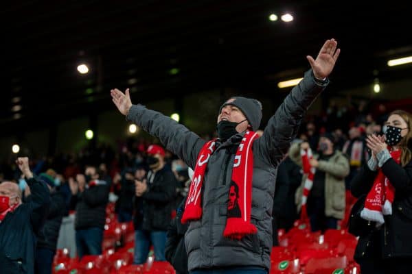 LIVERPOOL, ENGLAND - Sunday, December 6, 2020: A Liverpool supporter cheers on the players as they warm-up as the club welcomes 2,000 spectators back into the stadium, pictured before the FA Premier League match between Liverpool FC and Wolverhampton Wanderers FC at Anfield. (Pic by David Rawcliffe/Propaganda)