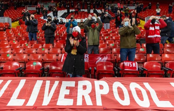 LIVERPOOL, ENGLAND - Sunday, December 6, 2020: A Liverpool supporter cheers on the players as they warm-up as the club welcomes 2,000 spectators back into the stadium, pictured before the FA Premier League match between Liverpool FC and Wolverhampton Wanderers FC at Anfield. (Pic by David Rawcliffe/Propaganda)