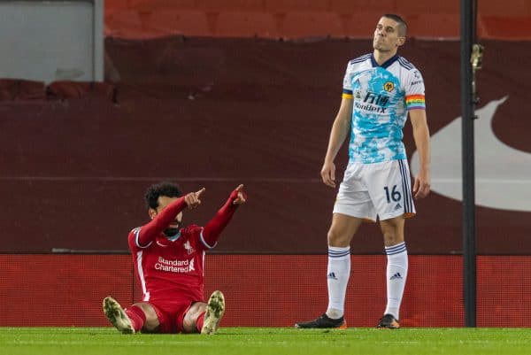 LIVERPOOL, ENGLAND - Sunday, December 6, 2020: Liverpool's Mohamed Salah celebrates after scoring the first goal as Wolverhampton Wanderers' captain Conor Coady looks dejected during the FA Premier League match between Liverpool FC and Wolverhampton Wanderers FC at Anfield. (Pic by David Rawcliffe/Propaganda)