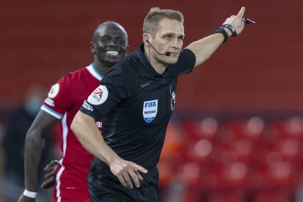 LIVERPOOL, ENGLAND - Sunday, December 6, 2020: Referee Craig Pawson reverses his decision to award Wolverhampton Wanderers a penalty after looking at a replay on the VAR monitor during the FA Premier League match between Liverpool FC and Wolverhampton Wanderers FC at Anfield. (Pic by David Rawcliffe/Propaganda)