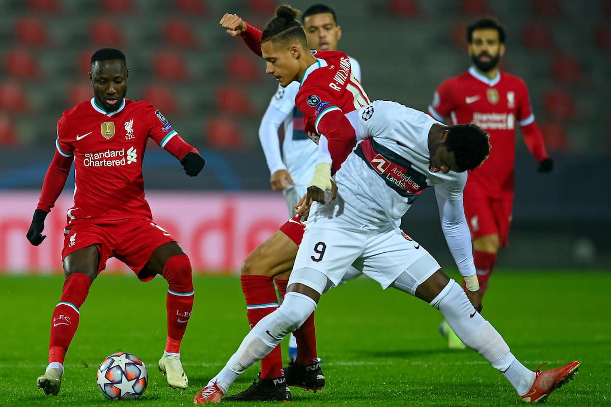 HERNING, DENMARK - Wednesday, December 9, 2020: Liverpool's Rhys Williams tackles FC Midtjylland's Sory Kaba (R) during the UEFA Champions League Group D match between FC Midtjylland and Liverpool FC at the Herning Arena. (Pic by Lars Møller/Propaganda)