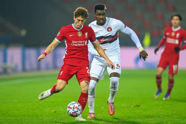 HERNING, DENMARK - Wednesday, December 9, 2020: Liverpool's Kostas Tsimikas (L) and FC Midtjylland's Sory Kaba during the UEFA Champions League Group D match between FC Midtjylland and Liverpool FC at the Herning Arena. (Pic by Lars Møller/Propaganda)