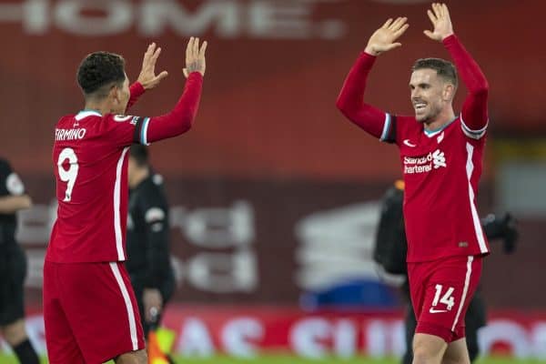 LIVERPOOL, ENGLAND - Wednesday, December 16, 2020: Liverpool's captain Jordan Henderson (R) celebrates with winning goal-scorer Roberto Firmino at the final whistle during the FA Premier League match between Liverpool FC and Tottenham Hotspur FC at Anfield. Liverpool won 2-1. (Pic by David Rawcliffe/Propaganda)