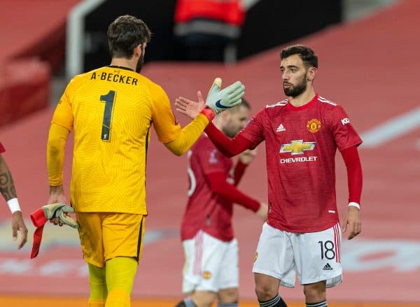 LIVERPOOL, ENGLAND - Sunday, January 24, 2021: Liverpool's goalkeeper Alisson Becker (L) with Manchester United's Bruno Fernandes after the FA Cup 4th Round match between Manchester United FC and Liverpool FC at Old Trafford. Manchester United won 3-2. (Pic by David Rawcliffe/Propaganda)