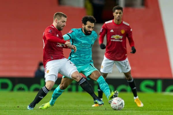 LIVERPOOL, ENGLAND - Sunday, January 24, 2021: Manchester United's Luke Shaw (L) and Liverpool's Mohamed Salah during the FA Cup 4th Round match between Manchester United FC and Liverpool FC at Old Trafford. (Pic by David Rawcliffe/Propaganda)