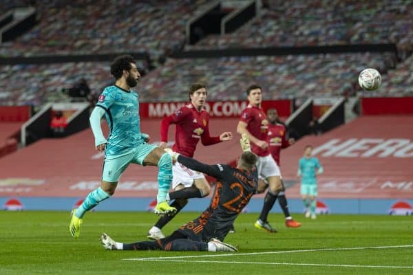 LIVERPOOL, ENGLAND - Sunday, January 24, 2021: Liverpool's Mohamed Salah scores the first goal chipping the ball over Manchester United's goalkeeper Dean Henderson during the FA Cup 4th Round match between Manchester United FC and Liverpool FC at Old Trafford. (Pic by David Rawcliffe/Propaganda)