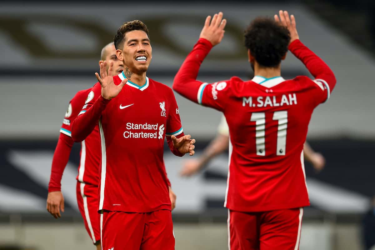 LONDON, ENGLAND - Thursday, January 28, 2021: Liverpool's Roberto Firmino (L) celebrates with team-mate Mohamed Salah (R) after scoring the first goal with the last kick of the first half during the FA Premier League match between Tottenham Hotspur FC and Liverpool FC at the Tottenham Hotspur Stadium. (Pic by Propaganda)