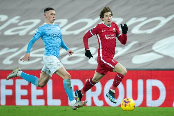 LIVERPOOL, ENGLAND - Sunday, February 7, 2021: Liverpool's Kostas Tsimikas (R) and Manchester City's Phil Foden during the FA Premier League match between Liverpool FC and Manchester City FC at Anfield. (Pic by David Rawcliffe/Propaganda)