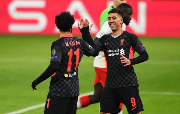 BUDAPEST, HUNGARY - Tuesday, February 16, 2021: Liverpool's Mohamed Salah (L) celebrates with team-mate Roberto Firmino after scoring the first goal during the UEFA Champions League Round of 16 1st Leg game between RB Leipzig and Liverpool FC at the Puskás Aréna. (Pic by Propaganda)