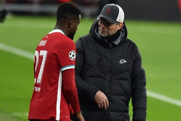 BUDAPEST, HUNGARY - Wednesday, March 10, 2021: Liverpool's manager Jürgen Klopp (L) prepares to bring on substitute Divock Origi during the UEFA Champions League Round of 16 2nd Leg game between Liverpool FC and RB Leipzig at the Puskás Aréna. (Pic by Propaganda)