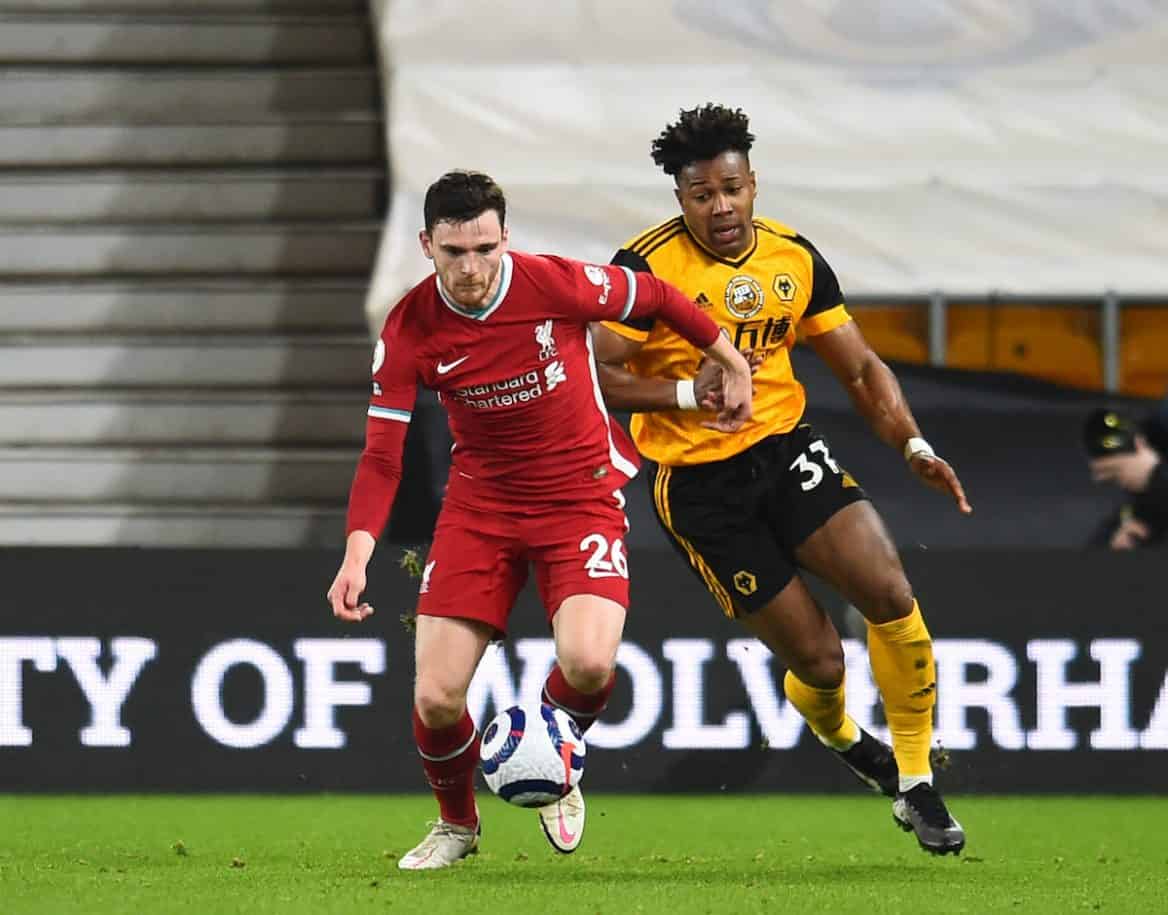 WOLVERHAMPTON, ENGLAND - Monday, March 15, 2021: Liverpool's Andy Robertson (L) and Wolverhampton Wanderers' Adama Traoré during the FA Premier League match between Wolverhampton Wanderers FC and Liverpool FC at Molineux Stadium. (Pic by Propaganda)