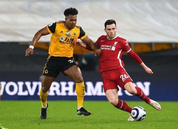 WOLVERHAMPTON, ENGLAND - Monday, March 15, 2021: Liverpool's Andy Robertson (R) and Wolverhampton Wanderers' Adama Traoré during the FA Premier League match between Wolverhampton Wanderers FC and Liverpool FC at Molineux Stadium. (Pic by Propaganda)