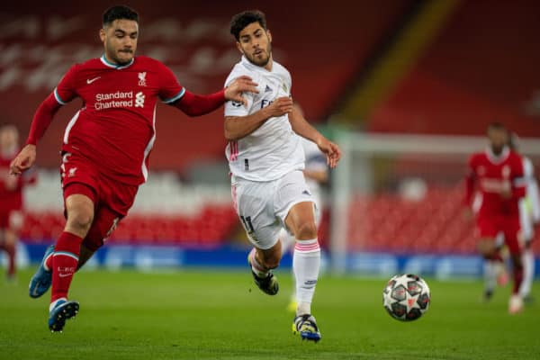 LIVERPOOL, ENGLAND - Wednesday, April 14, 2021: Liverpool's Ozan Kabak (L) challenges Real Madrid's Marco Asensio during the UEFA Champions League Quarter-Final 2nd Leg game between Liverpool FC and Real Madird CF at Anfield. (Pic by David Rawcliffe/Propaganda)