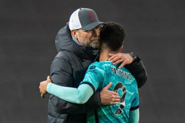 MANCHESTER, ENGLAND - Thursday, May 13, 2021: Liverpool's manager Jürgen Klopp embraces Roberto Firmino after the FA Premier League match between Manchester United FC and Liverpool FC at Old Trafford. Liverpool won 4-2. (Pic by David Rawcliffe/Propaganda)