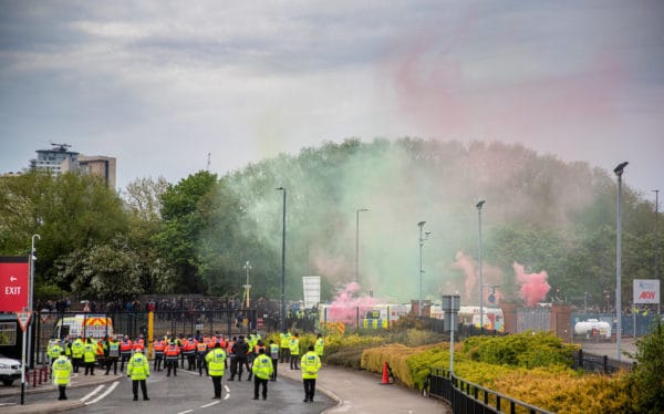 MANCHESTER, ENGLAND - Thursday, May 13, 2021: Manchester United supporters protest at a gate they believe the team coaches use to access the stadium before the FA Premier League match between Manchester United FC and Liverpool FC at Old Trafford. (Pic by David Rawcliffe/Propaganda)MANCHESTER, ENGLAND - Thursday, May 13, 2021: Manchester United supporters protest at a gate they believe the team coaches use to access the stadium before the FA Premier League match between Manchester United FC and Liverpool FC at Old Trafford. (Pic by David Rawcliffe/Propaganda)